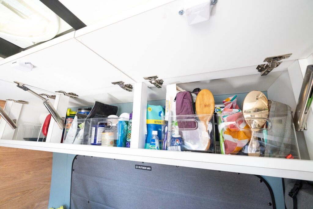 Overhead cabinets in a 4x4 Mercedes Sprinter Van conversion built by Outside Van