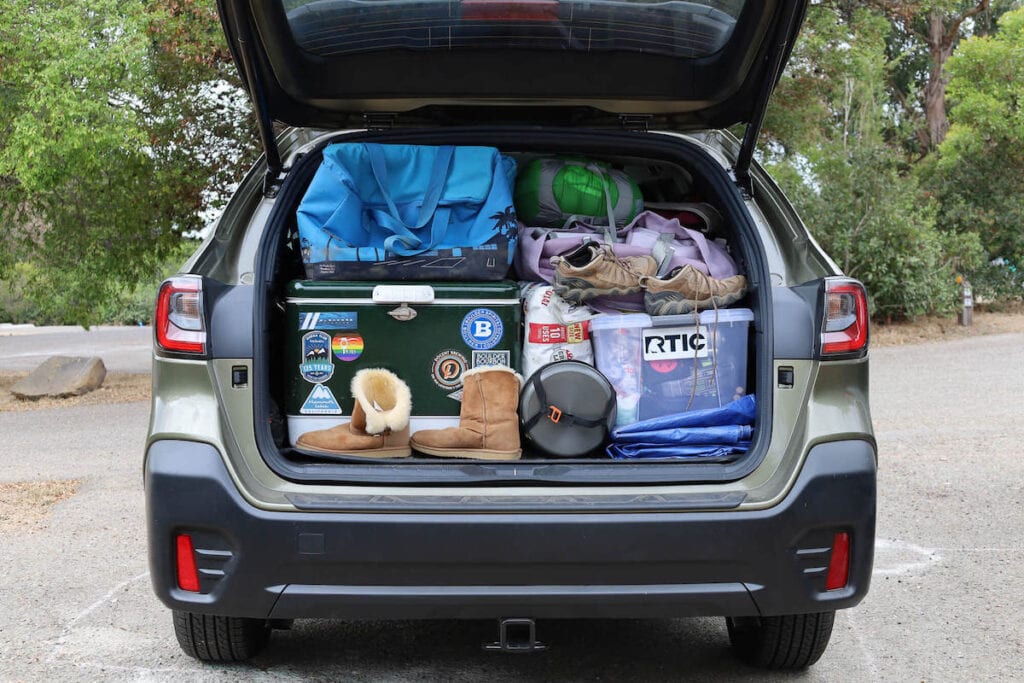 Trunk of Subaru packed with car camping essentials