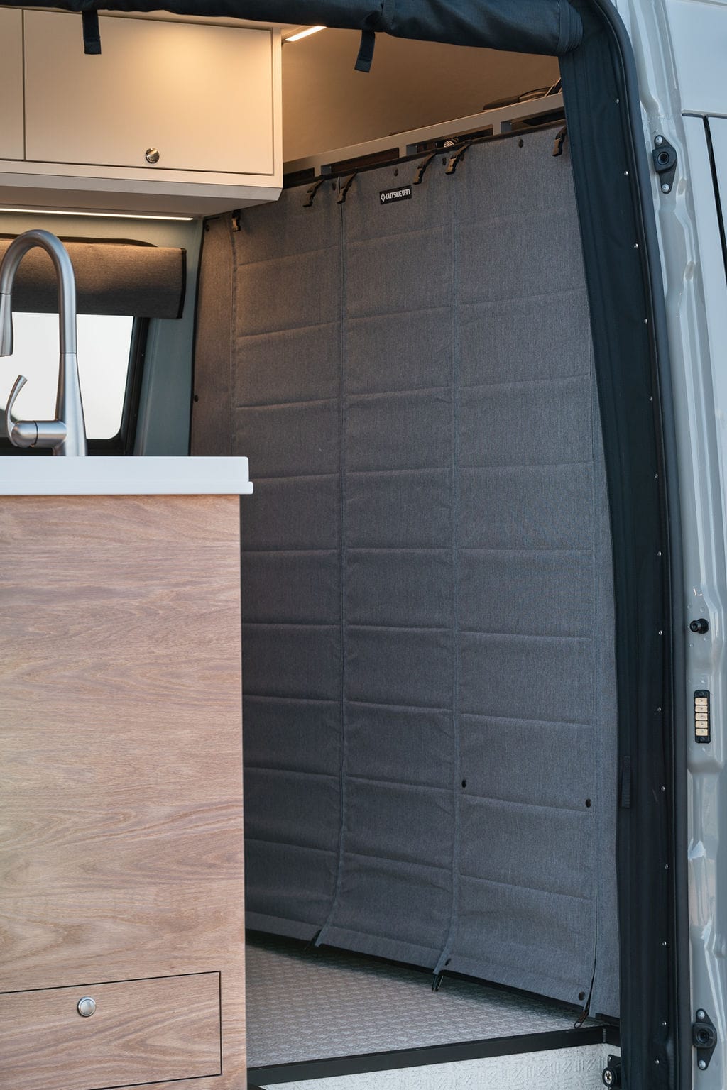 Outside Van soft wall that separates the cab from the living area in a Sprinter camper van