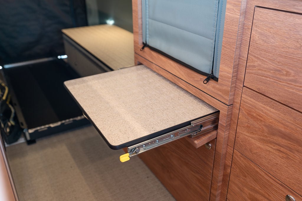 Step for getting into platform bed in a Sprinter Van conversion built by Outside Van